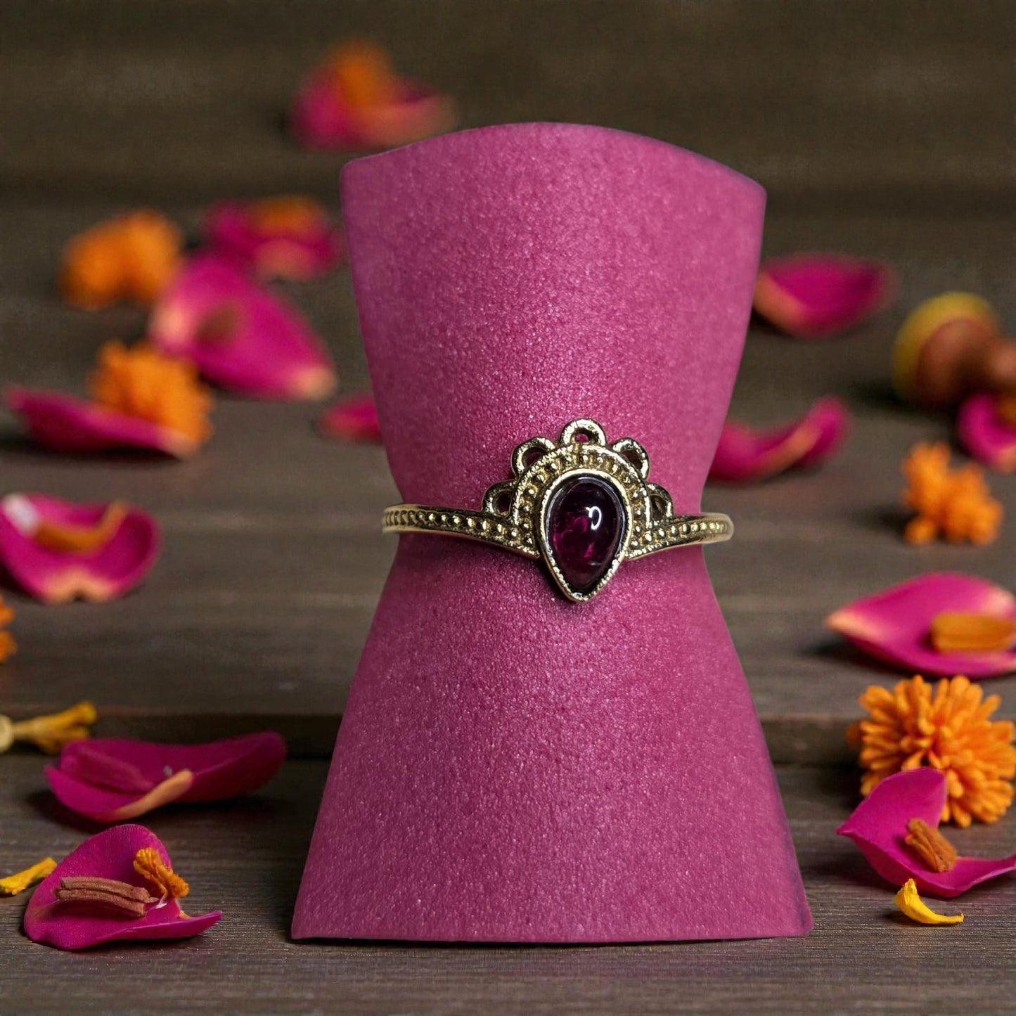 Brass ring with granat stone