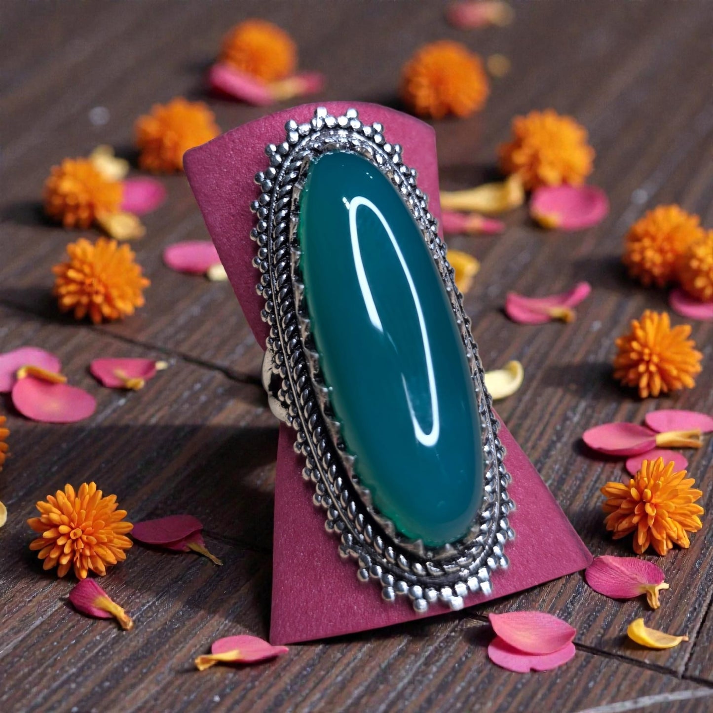 Steel ring with green stone