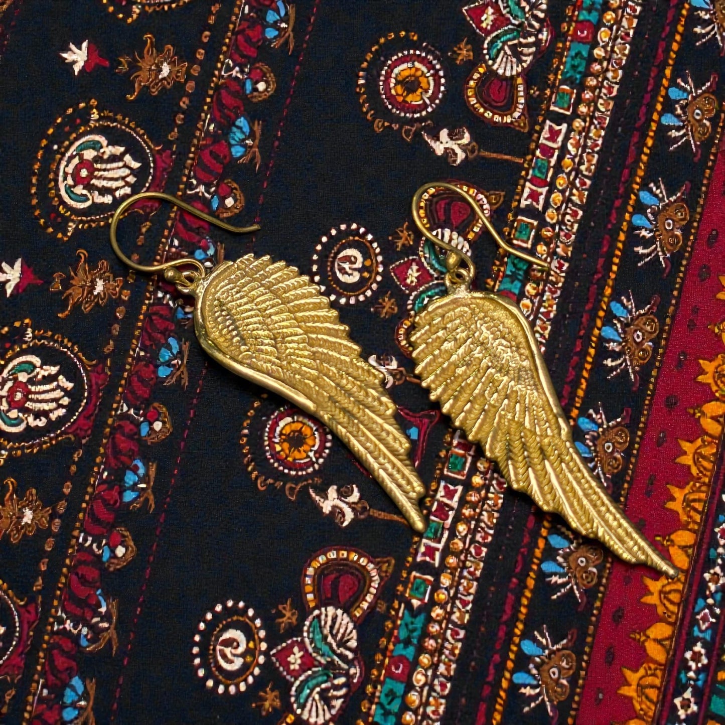 Brass dangling wings earring